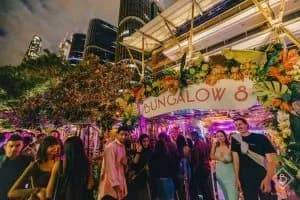 Bungalow 8 entrance signage lit up at night, King Street Wharf